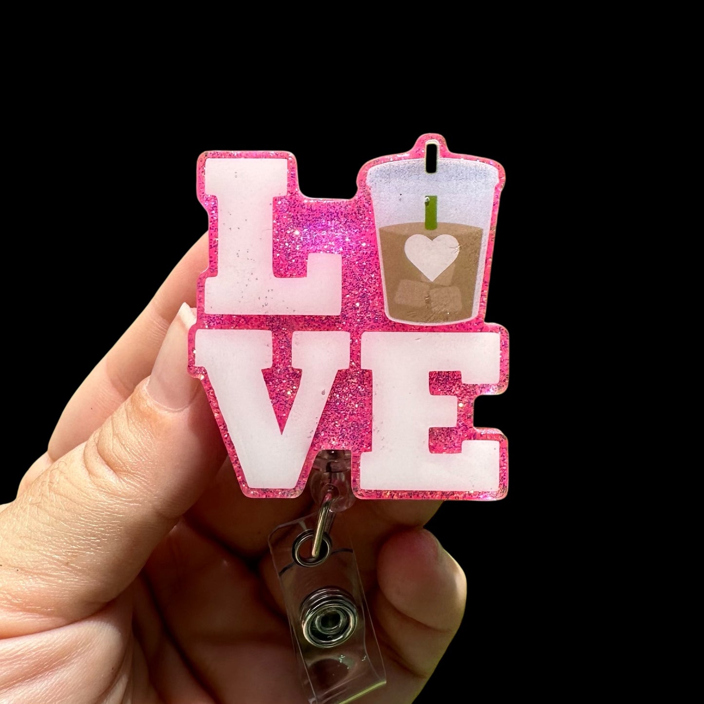 Pink glittery 'LOVE' badge holder with a drink icon
