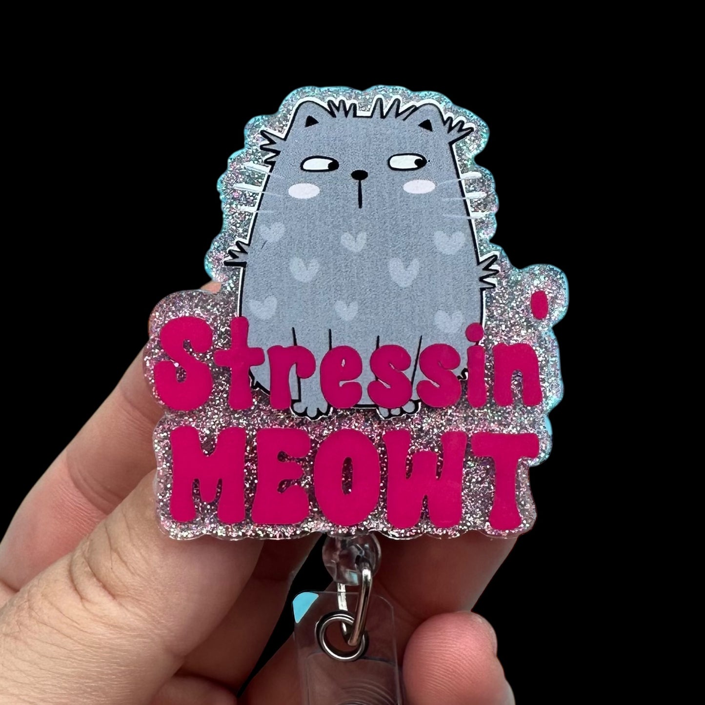 Cat-shaped keychain with 'Stressin MEOWT' text