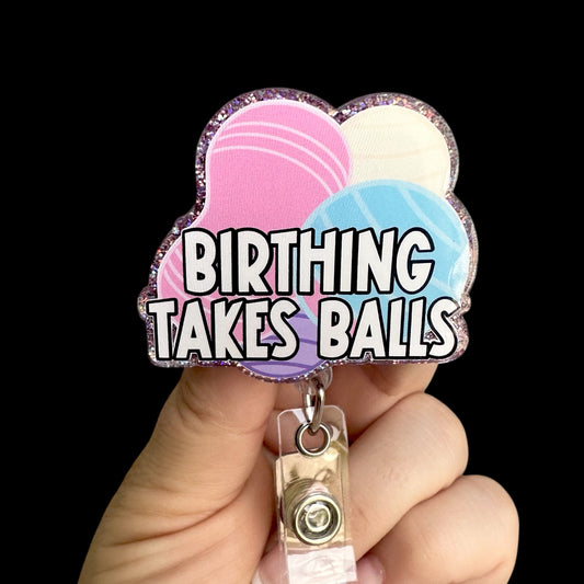 Colorful badge holder with 'Birthing Takes Balls' text 