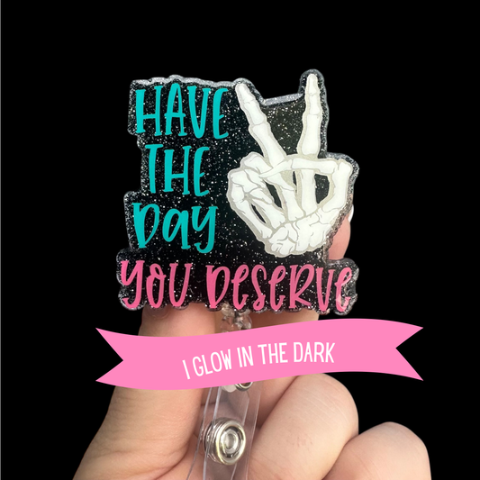 Pin with peace sign hand and motivational quote "HAVE THE DAY YOU DESERVE" Glows in the dark 