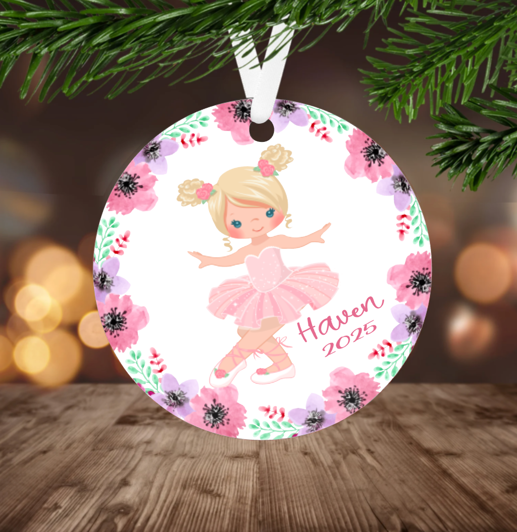 Christmas ornament with a ballerina design and floral elements, hanging on a Christmas tree.