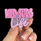 Pink glittery badge holder with 'MED-SURG Life' text