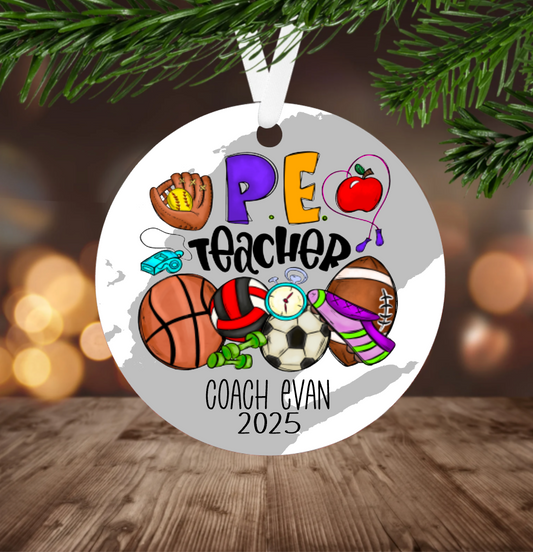 Decorative Christmas ornament for a PE teacher with sports-themed design, hanging on a tree.