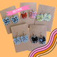 Bow earrings with a sport ball printed to the bow
