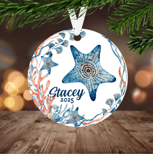 Decorative Christmas ornament with starfish design and personalized name and year