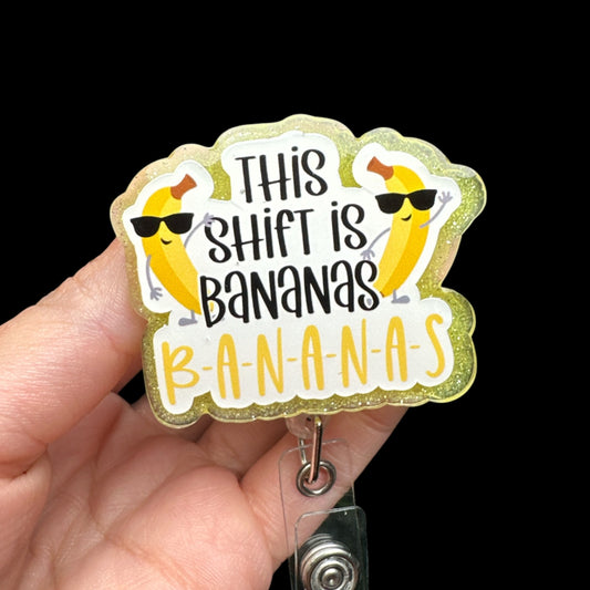 A badge reel with a yellow and green design featuring bananas and the phrase 'This Shift is Bananas'.