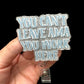 A badge reel with the text 'YOU CAN'T LEAVE AMA YOU WORK HERE' printed on it.