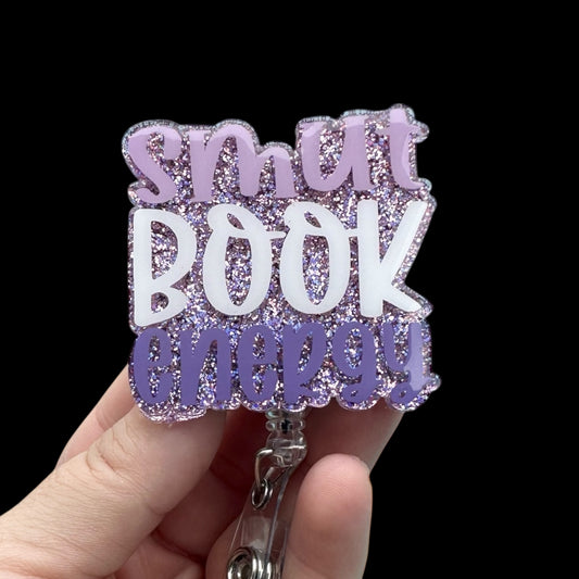 Badge holder with 'smart book lover' text in glittery purple and white 